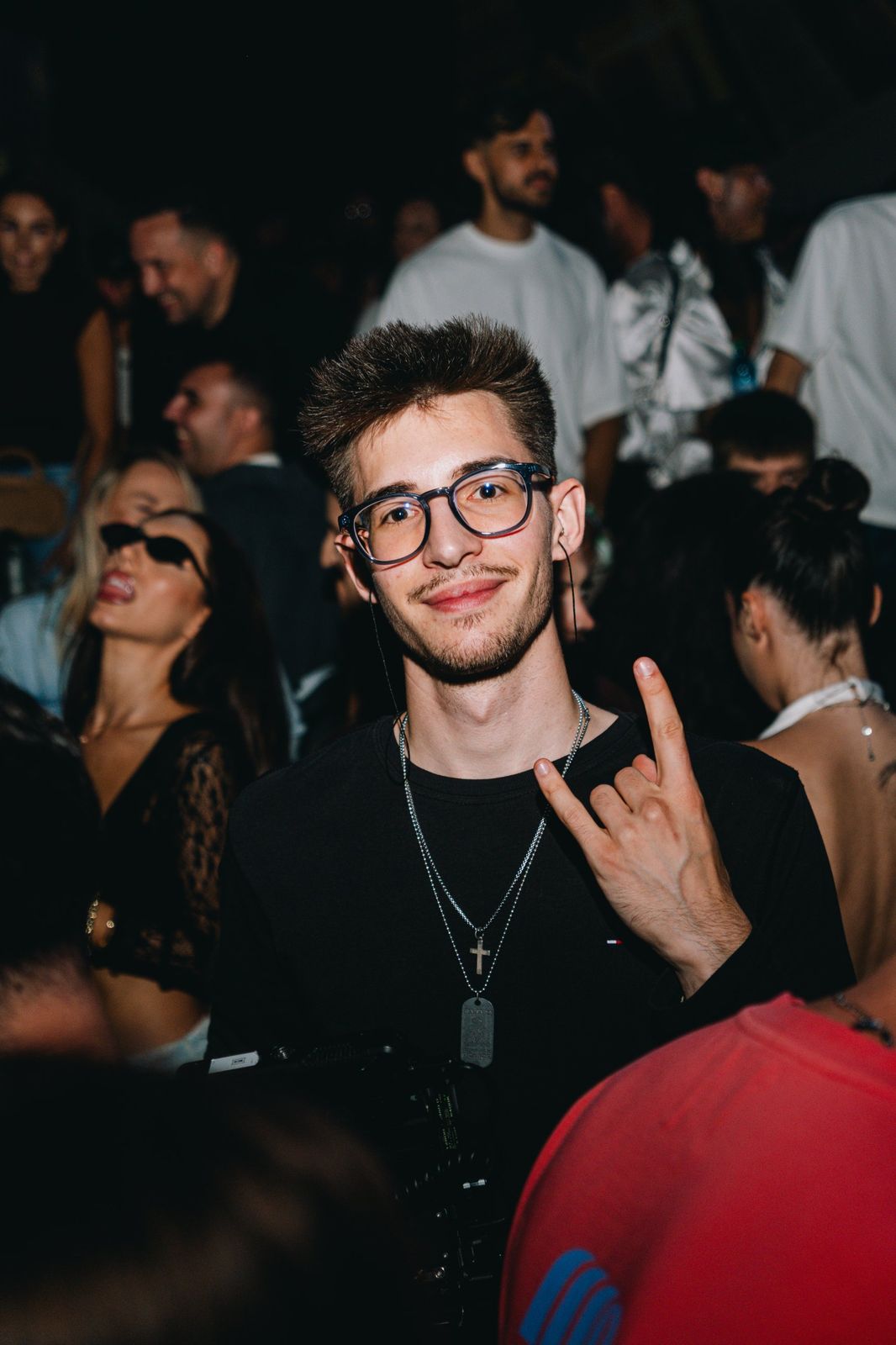 Matei Bostan smiling in the crowd at an event, holding his gimbal